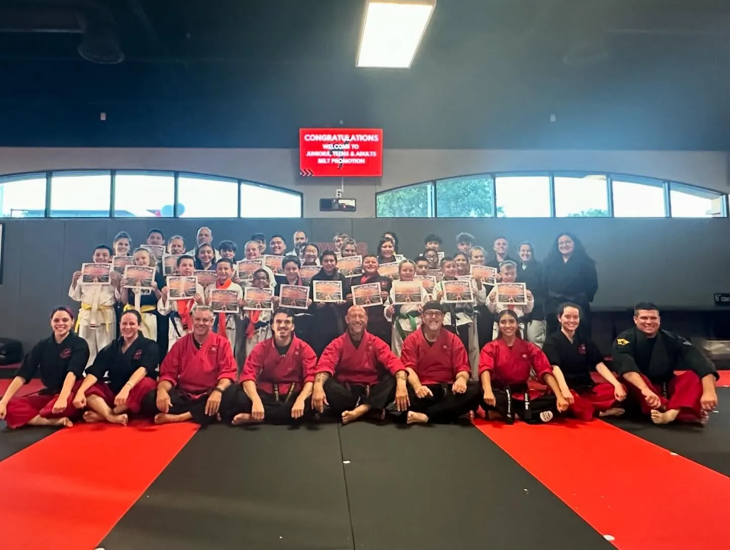 Master Carlos Machado students lined up at a belt promotion in Carrollton, TX