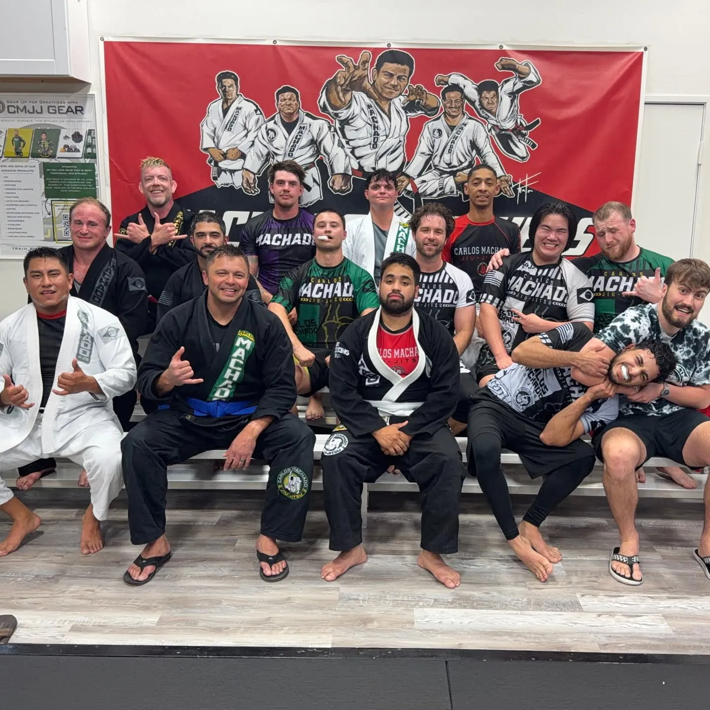 A large group of adult Machado Method students together after a Brazilian Jiu-Jitsu class in Carrollton, TX
