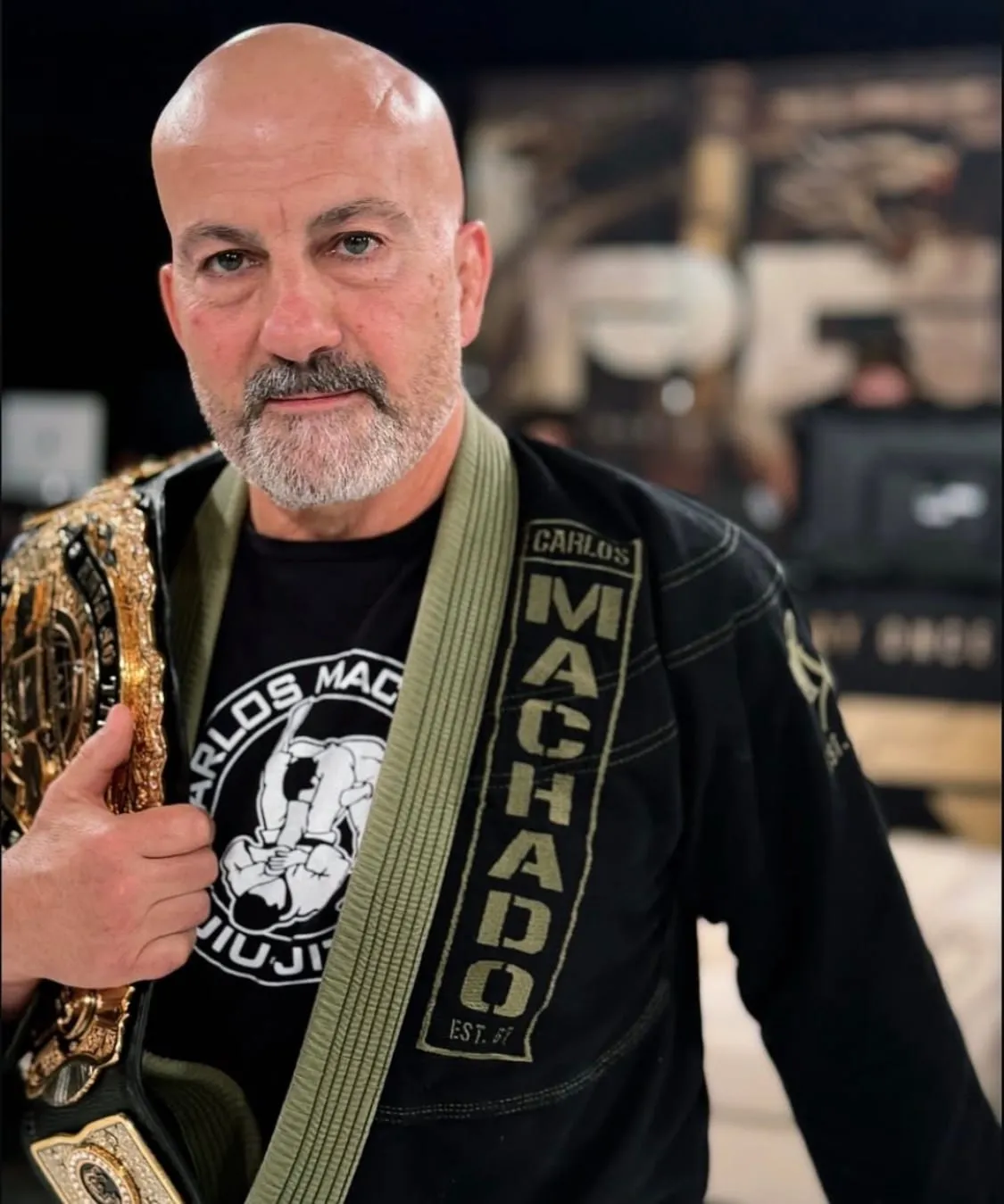 Master Carlos Machado, 8th Degree Coral Belt and founder of the Machado Method Jiu-Jitsu Association, in his gi